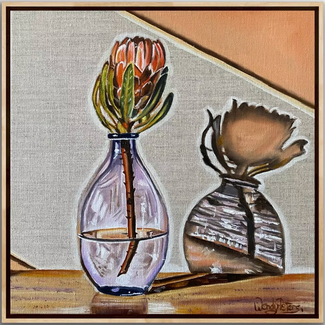 Purple Haze by Wendy Peters A Framed artwork depicting a purple glass vase with a pink protea flower, the vase creating amazing shadows on the wall behind.