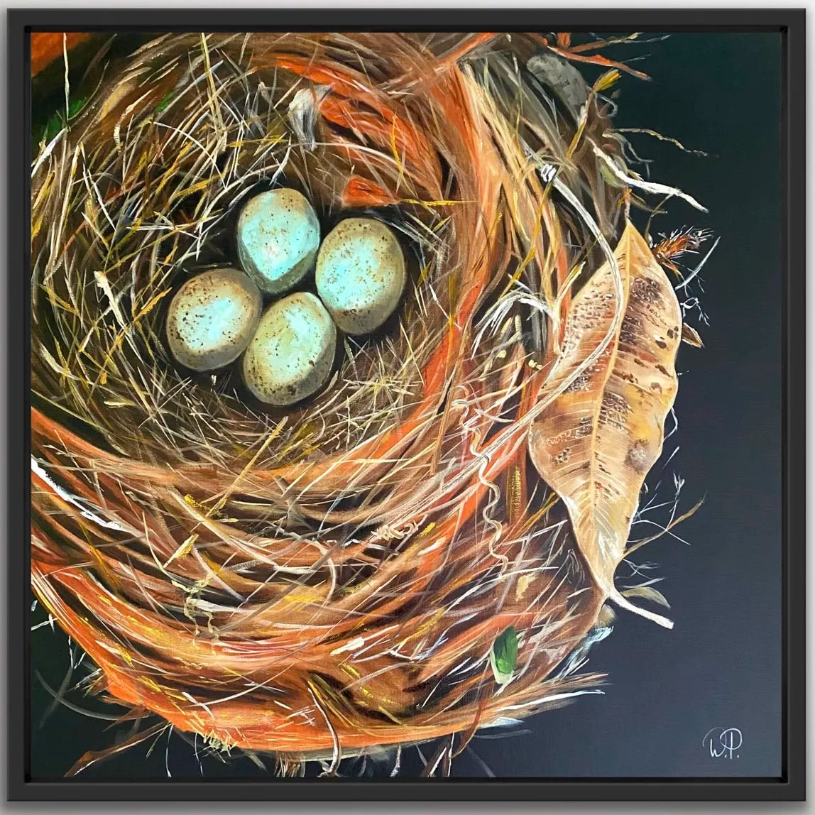 A framed original painting  by wendy peters  of a detailed and colorful bird's nest with blue eggs in the center, surrounded by dried leaves and twigs against a dark background.